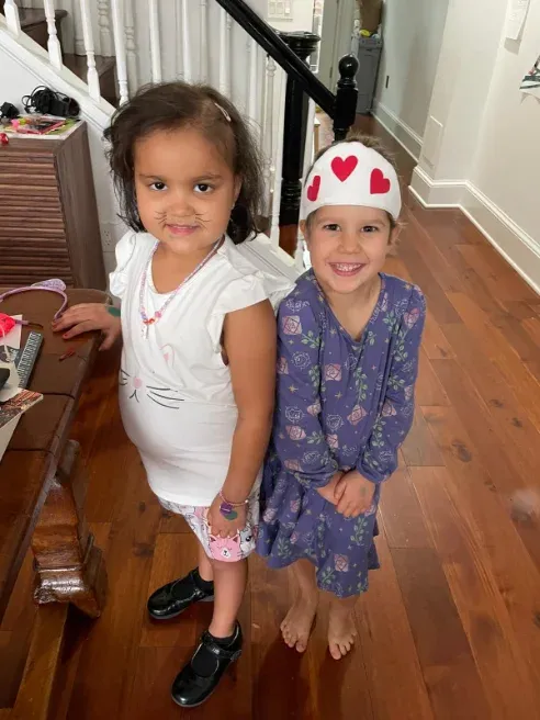 Pen pals Amelia and Maryam standing together
